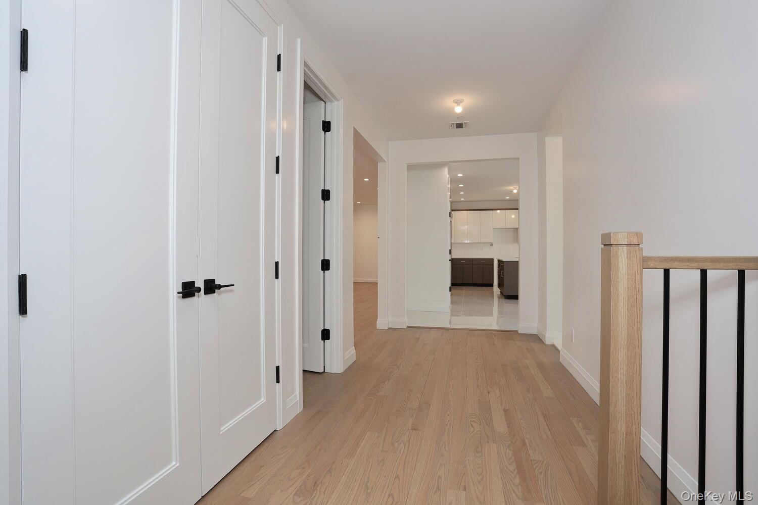 4 Howard Drive, Unit 213 Spring Valley, NY 10977 - Photo 23 of 42 a view of a hallway with wooden floor and closet area