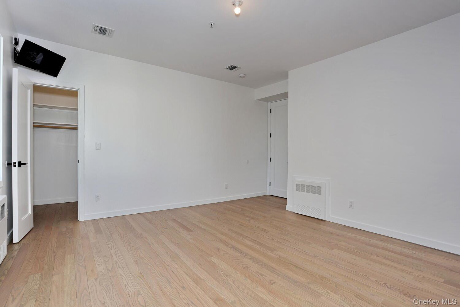4 Howard Drive, Unit 213 Spring Valley, NY 10977 - Photo 27 of 42 wooden floor in an empty room