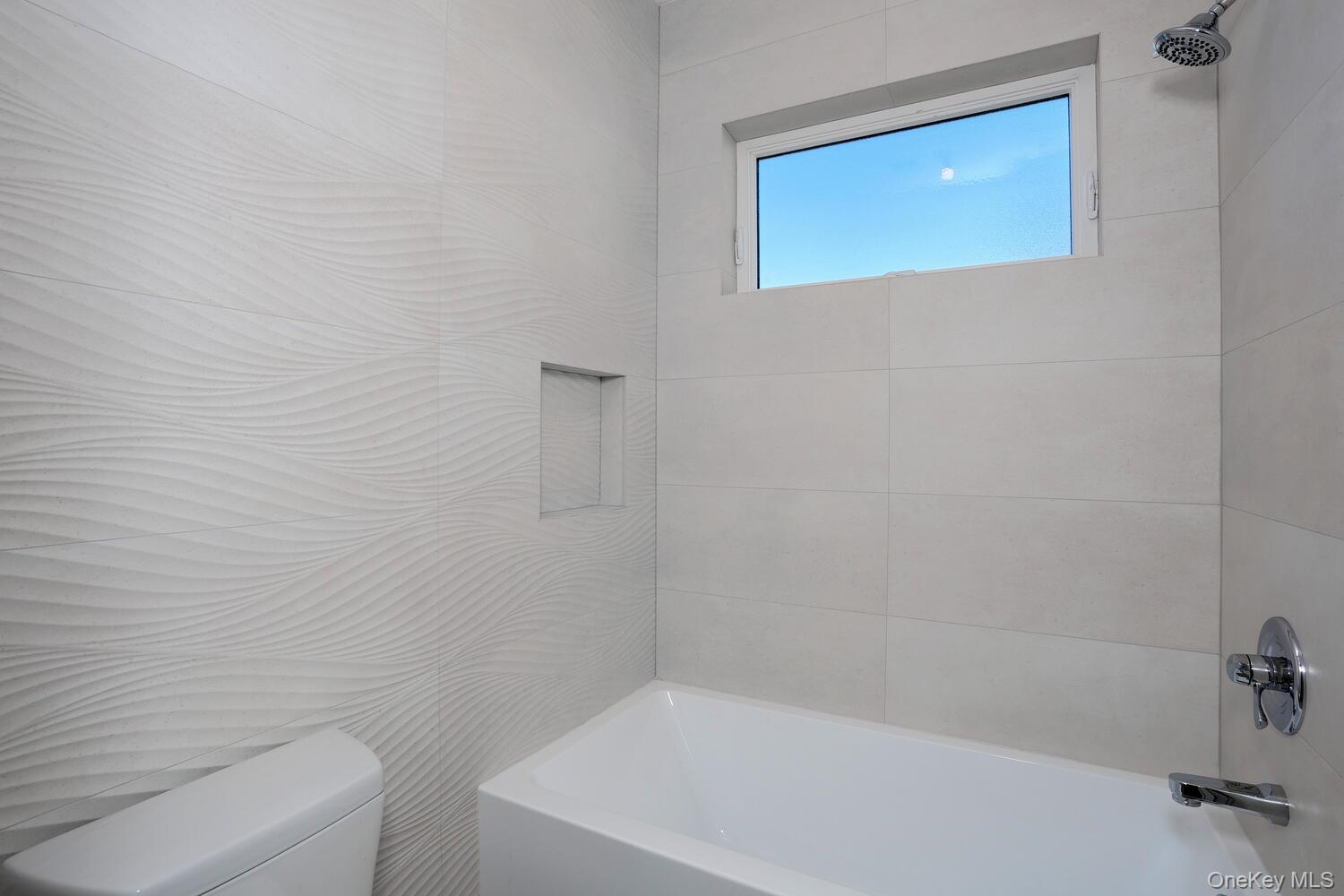 4 Howard Drive, Unit 213 Spring Valley, NY 10977 - Photo 29 of 42 a bathroom with a bathtub