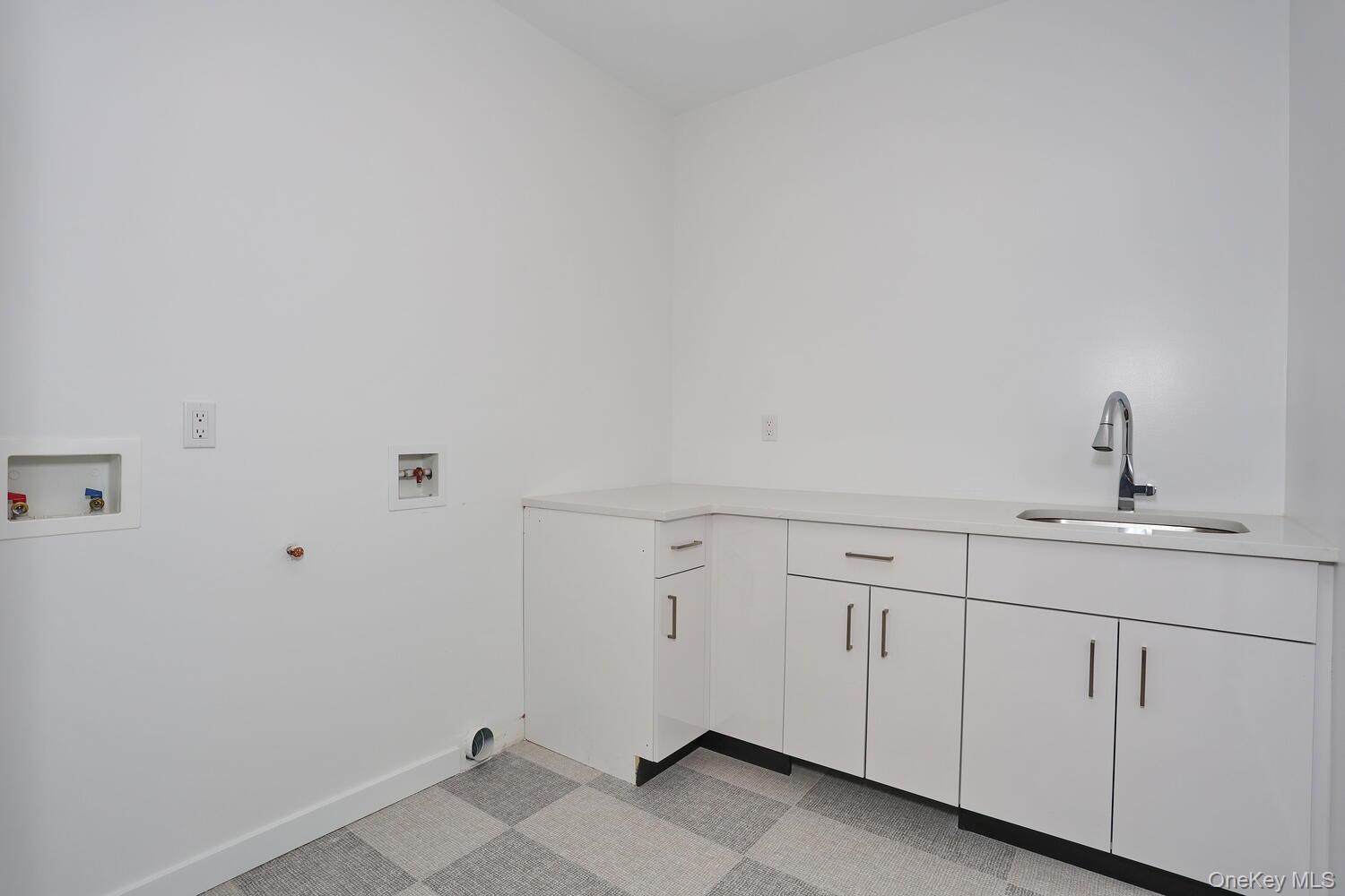 4 Howard Drive, Unit 213 Spring Valley, NY 10977 - Photo 31 of 42 a bathroom with white cabinets
