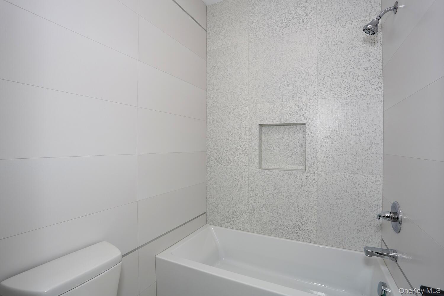 4 Howard Drive, Unit 213 Spring Valley, NY 10977 - Photo 33 of 42 a bathroom with a bathtub