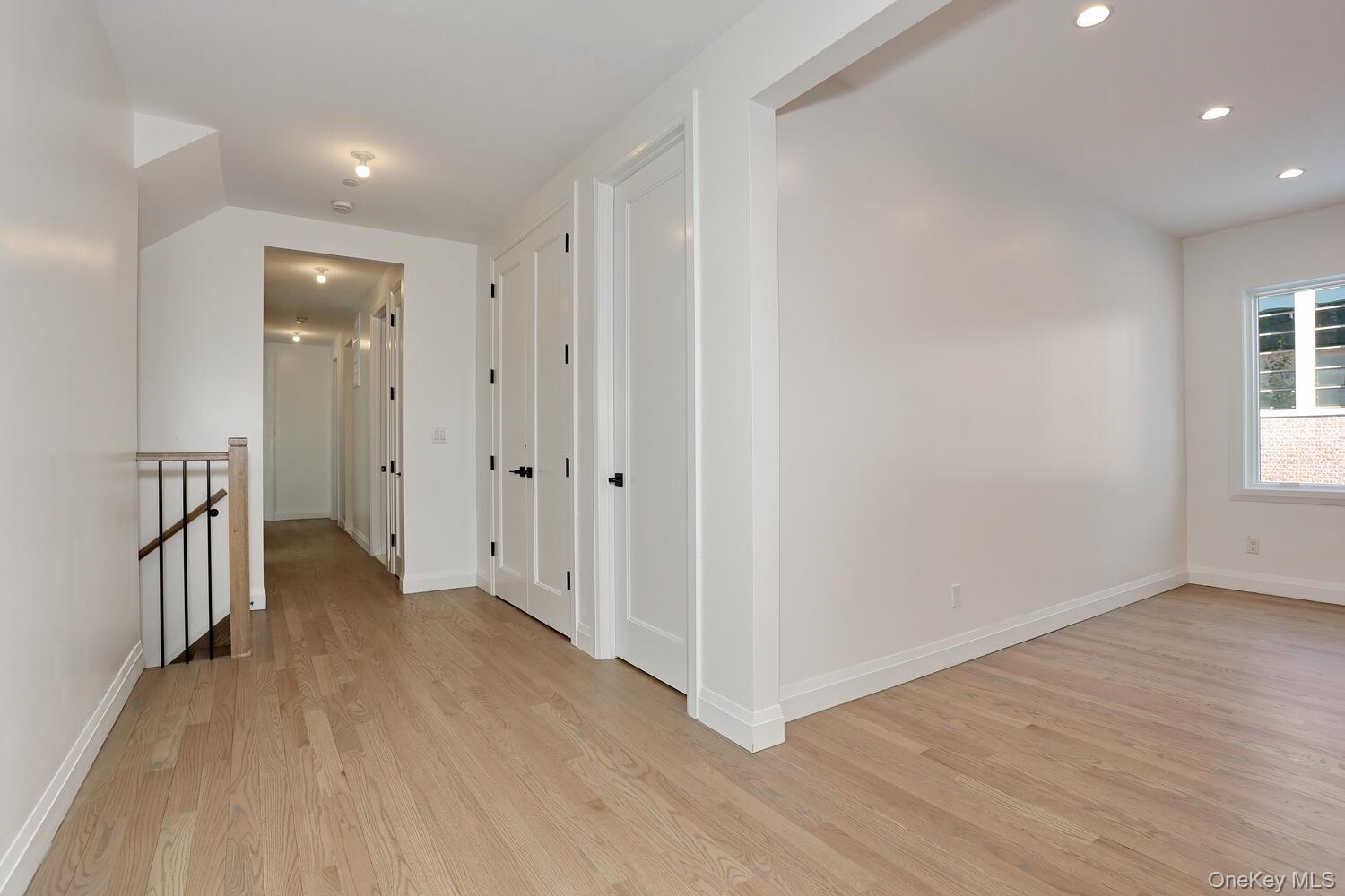 4 Howard Drive, Unit 213 Spring Valley, NY 10977 - Photo 35 of 42 a view of an empty room with wooden floor and a window