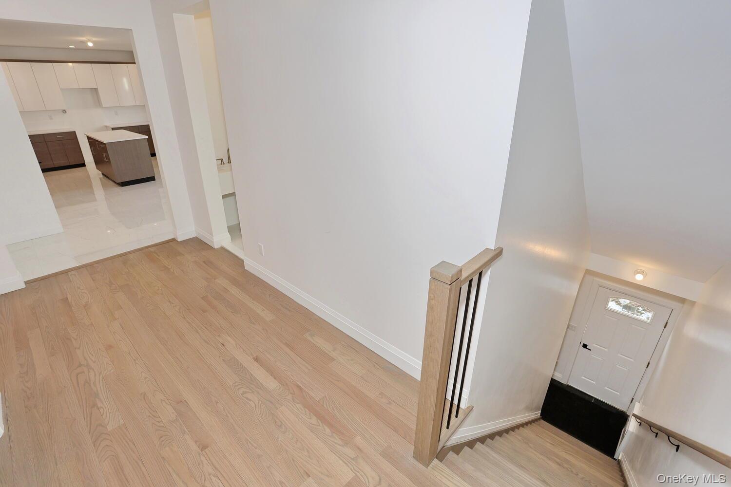 4 Howard Drive, Unit 213 Spring Valley, NY 10977 - Photo 4 of 42 a view of a hallway with wooden floor and seating space