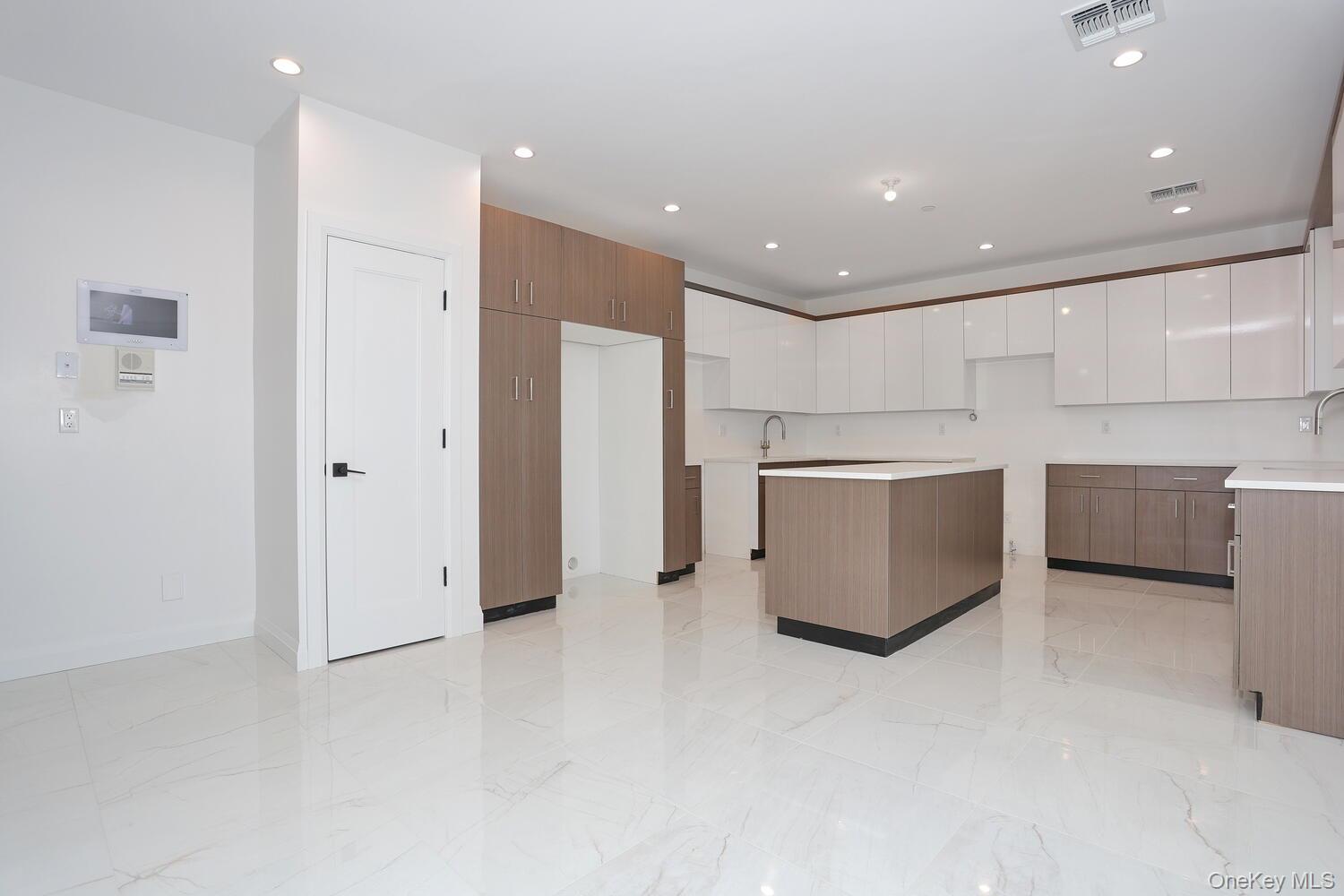 4 Howard Drive, Unit 213 Spring Valley, NY 10977 - Photo 6 of 42 a view of a kitchen with stainless steel appliances cabinets