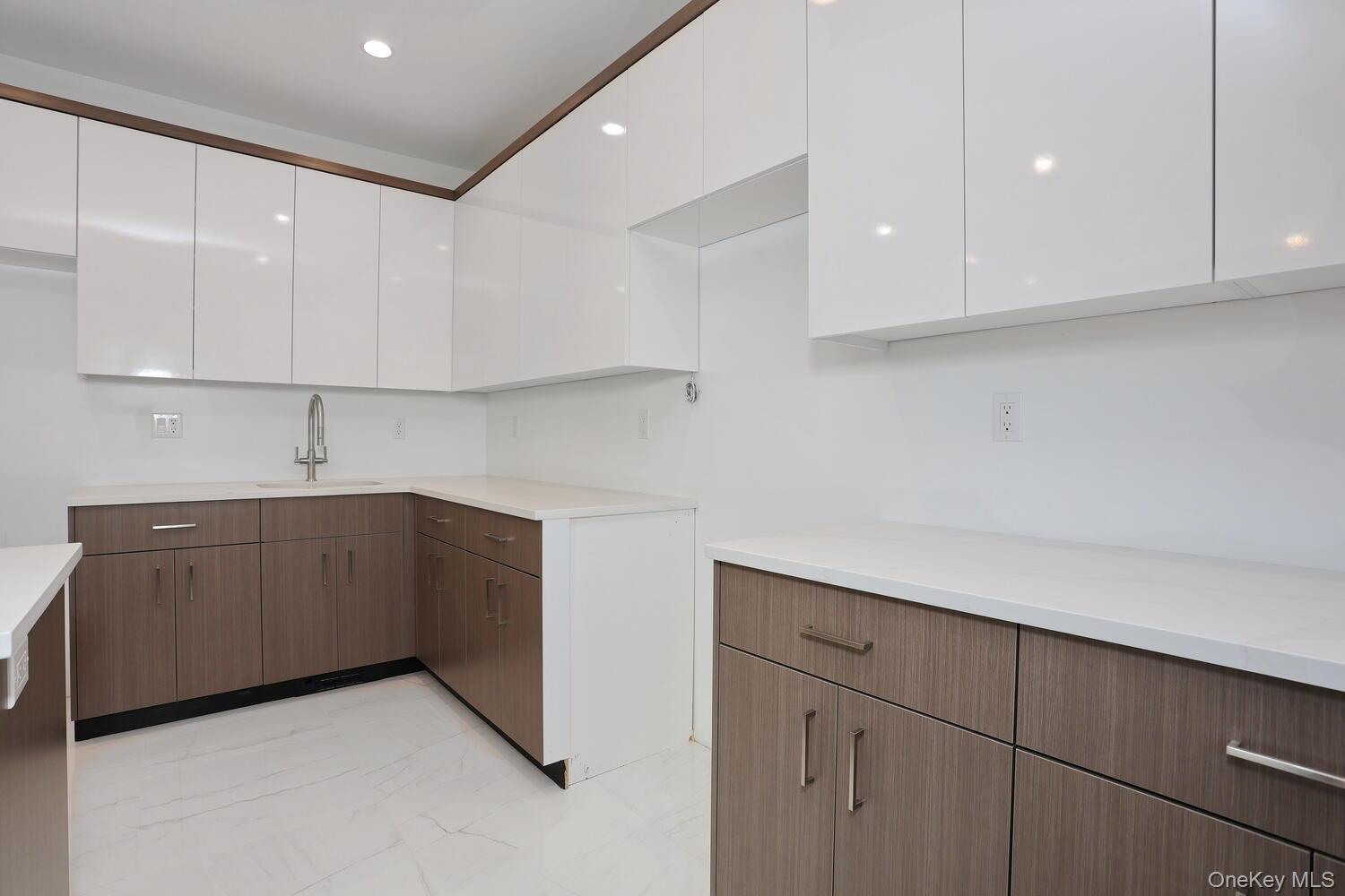 4 Howard Drive, Unit 213 Spring Valley, NY 10977 - Photo 9 of 42 a kitchen with sink cabinets and window