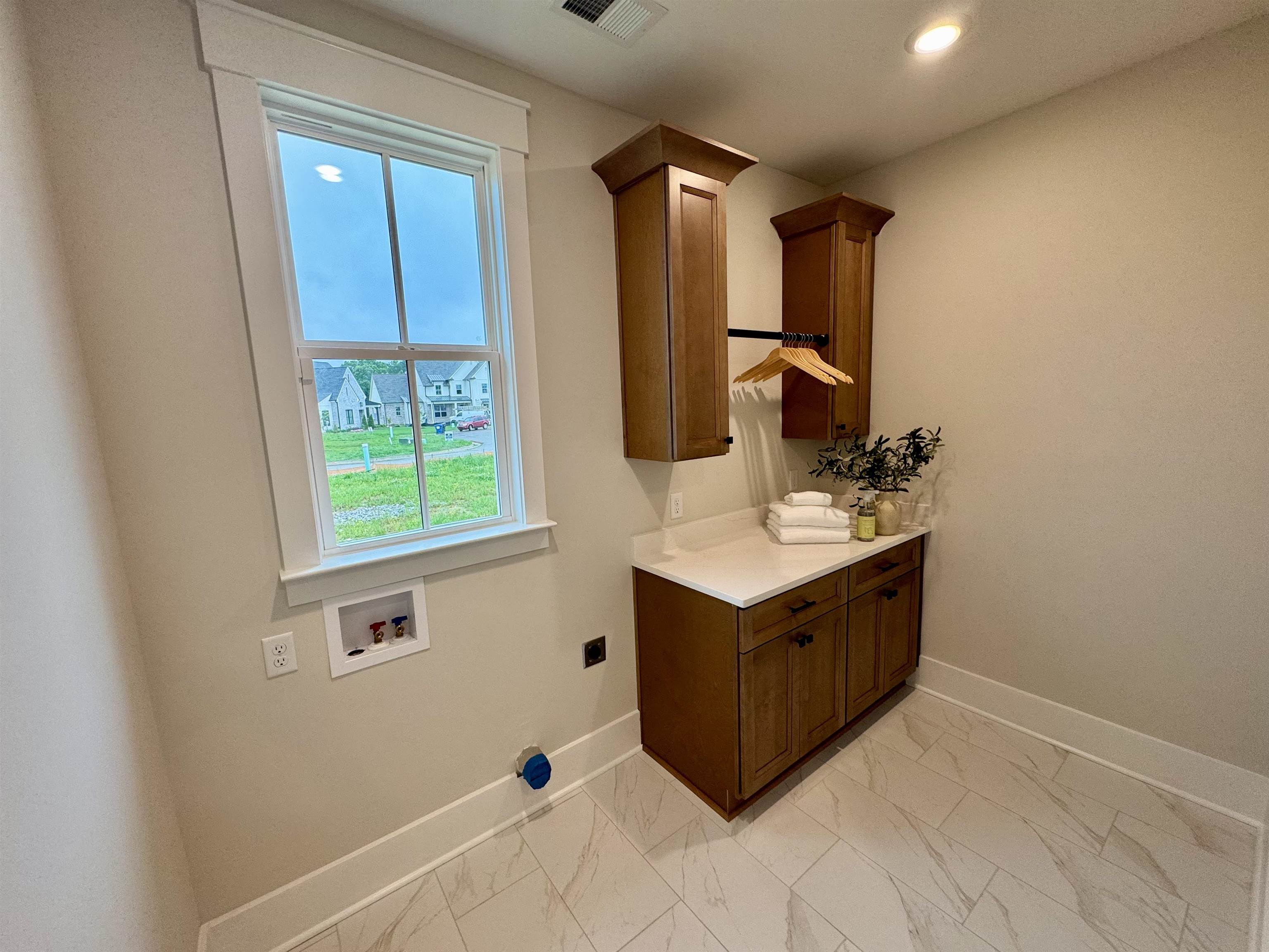 20 Rambling Rex Trail Piperton, TN 38017 - Photo 23 of 31 a bathroom with a sink vanity and mirror