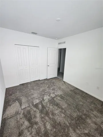 a bathroom with a bathtub a sink a toilet a mirror and vanity