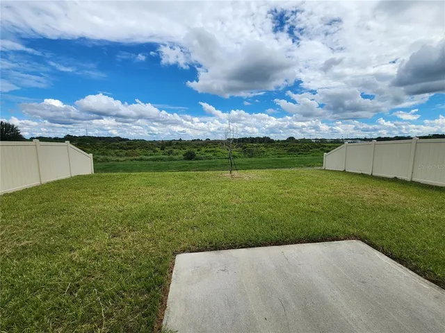 a view of a lake with a big yard