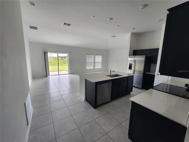 a large bathroom with a bathtub and a sink