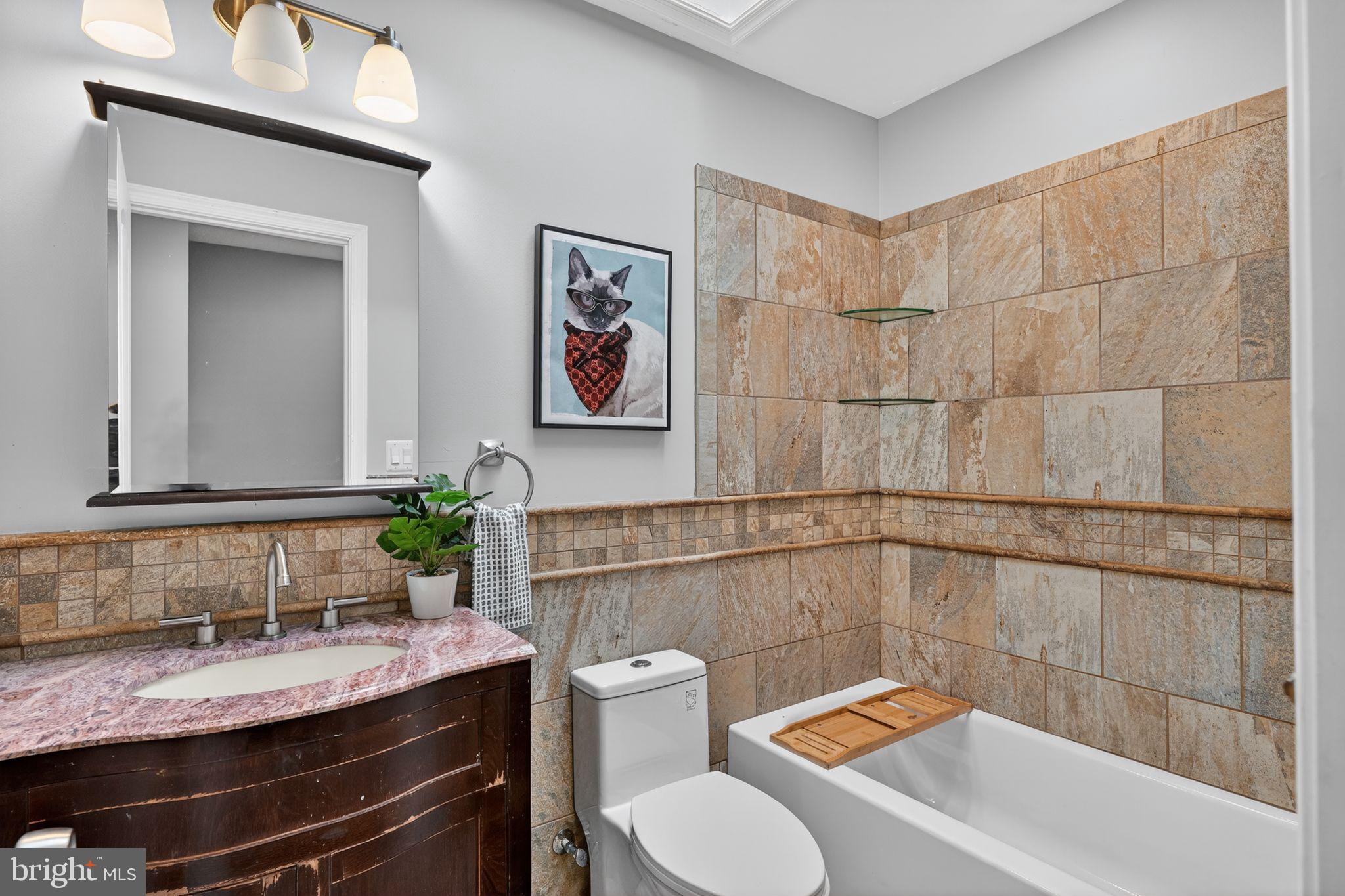 522 21st Street Northeast Washington, DC 20002 - Photo 18 of 29 Elegant bathroom with stylish stone accents.