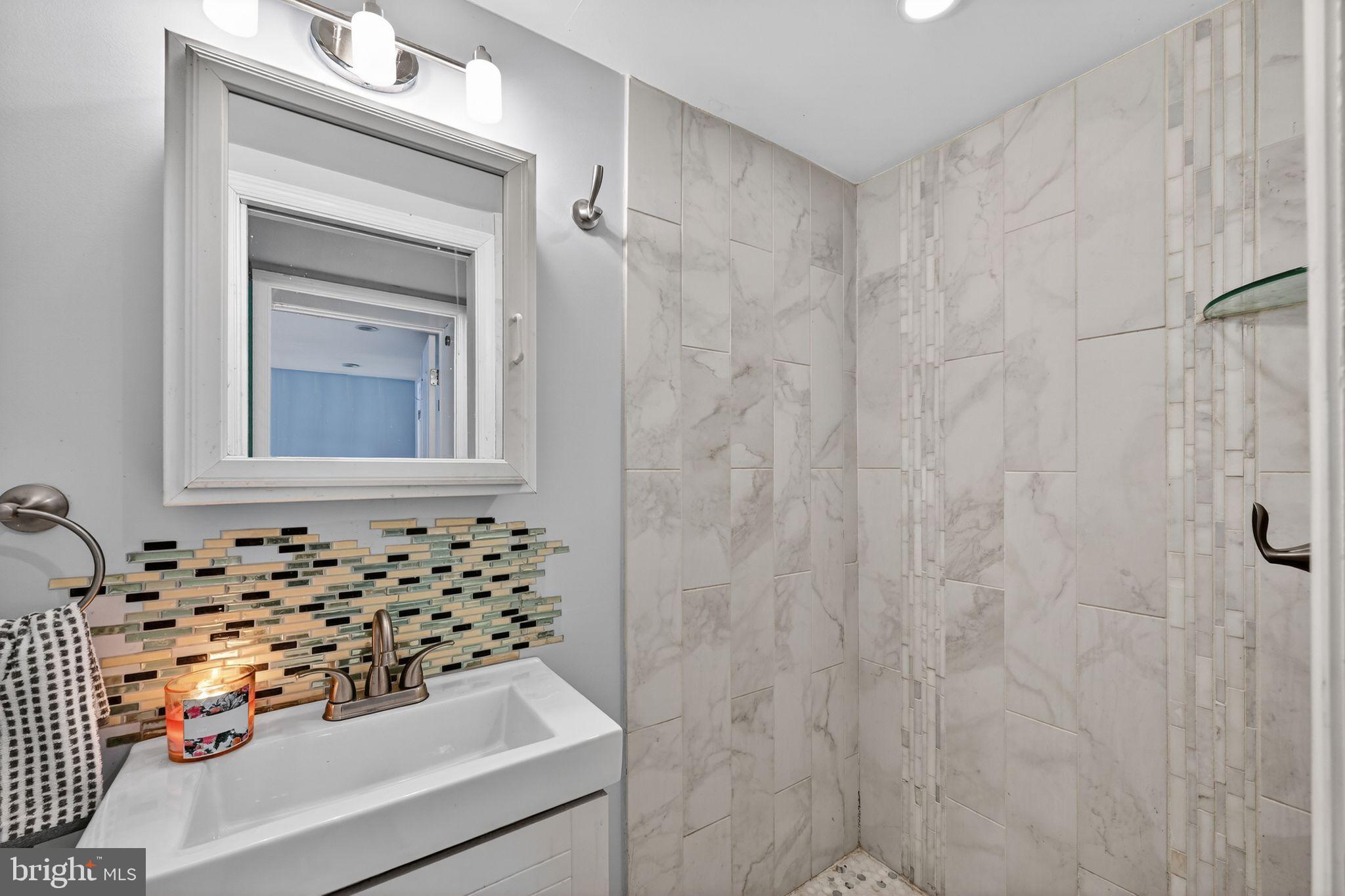 522 21st Street Northeast Washington, DC 20002 - Photo 25 of 29 Modern shower with elegant tile accents.