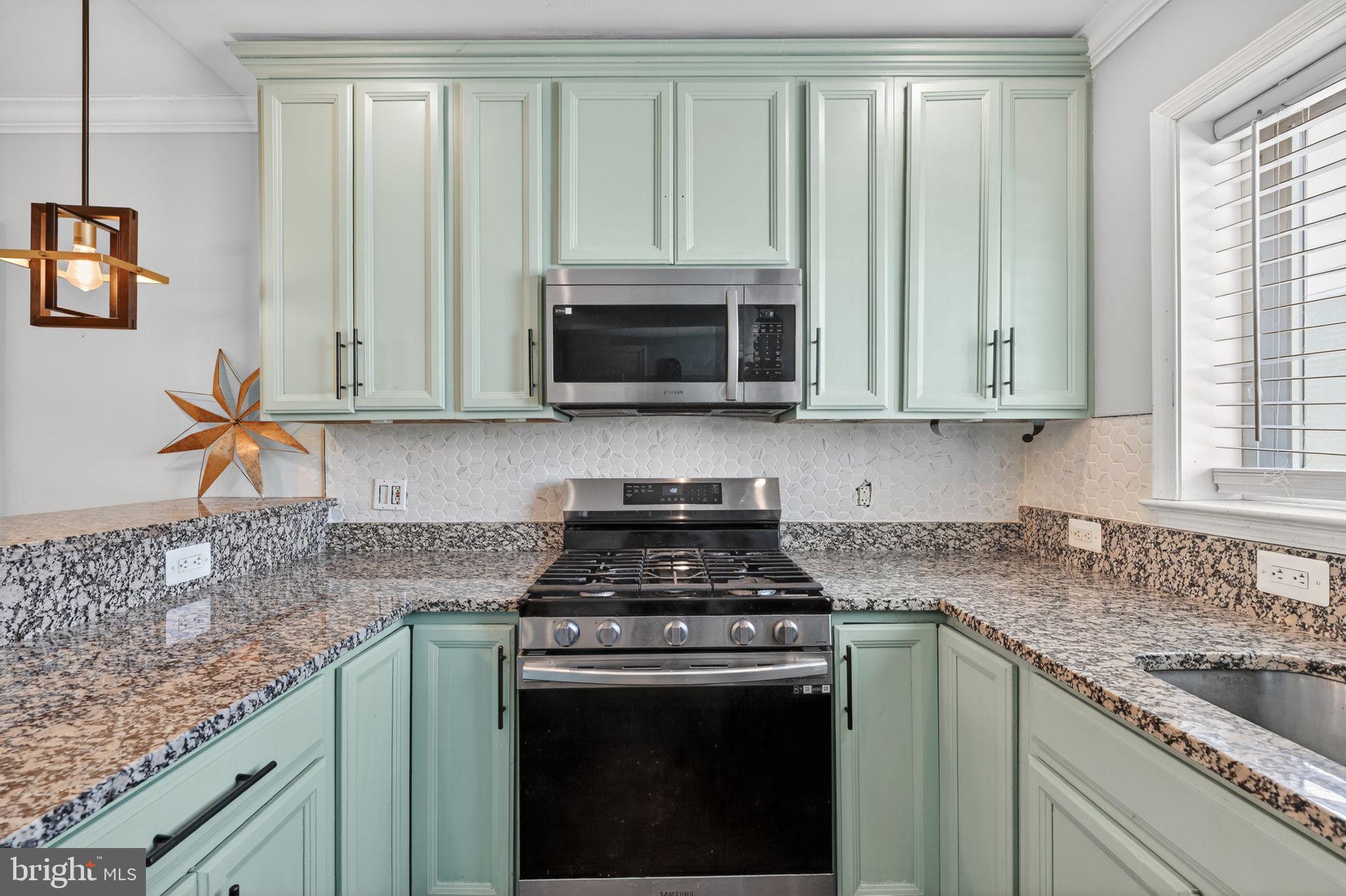 522 21st Street Northeast Washington, DC 20002 - Photo 9 of 29 Charming kitchen with mint cabinetry and granite.