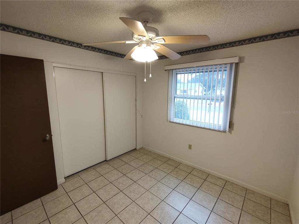 8565 Southwest 109th Street Ocala, FL 34481 - Photo 12 of 27 a view of an empty room with window