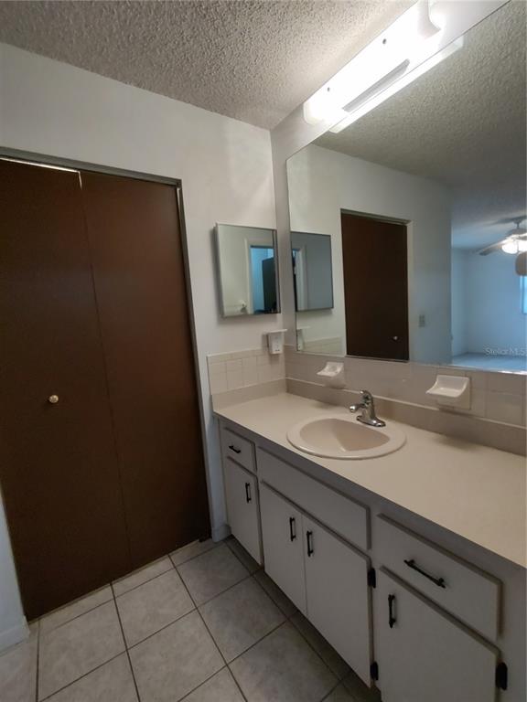 8565 Southwest 109th Street Ocala, FL 34481 - Photo 15 of 27 a bathroom with a double vanity sink and a mirror