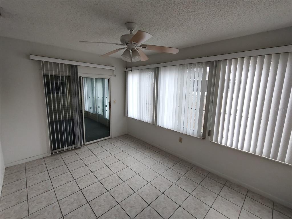 8565 Southwest 109th Street Ocala, FL 34481 - Photo 19 of 27 a view of an empty room and window
