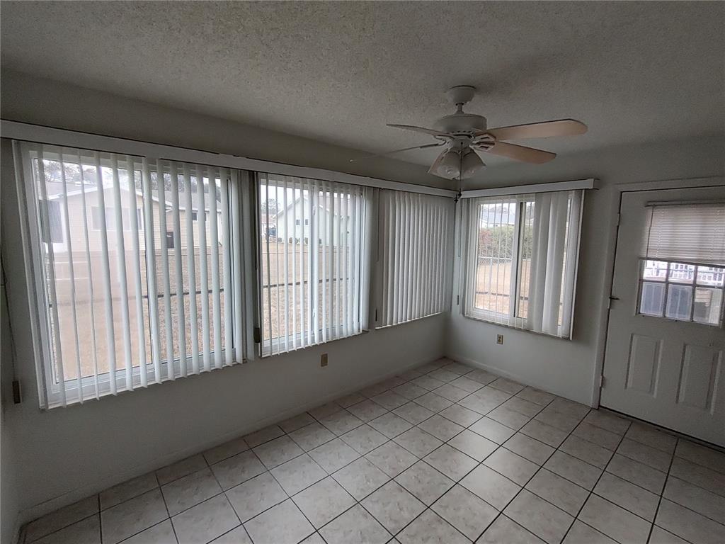 8565 Southwest 109th Street Ocala, FL 34481 - Photo 20 of 27 a view of an empty room with a window