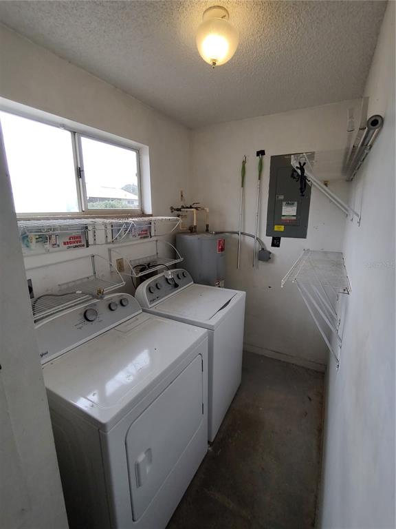 8565 Southwest 109th Street Ocala, FL 34481 - Photo 23 of 27 a utility room with dryer and washer