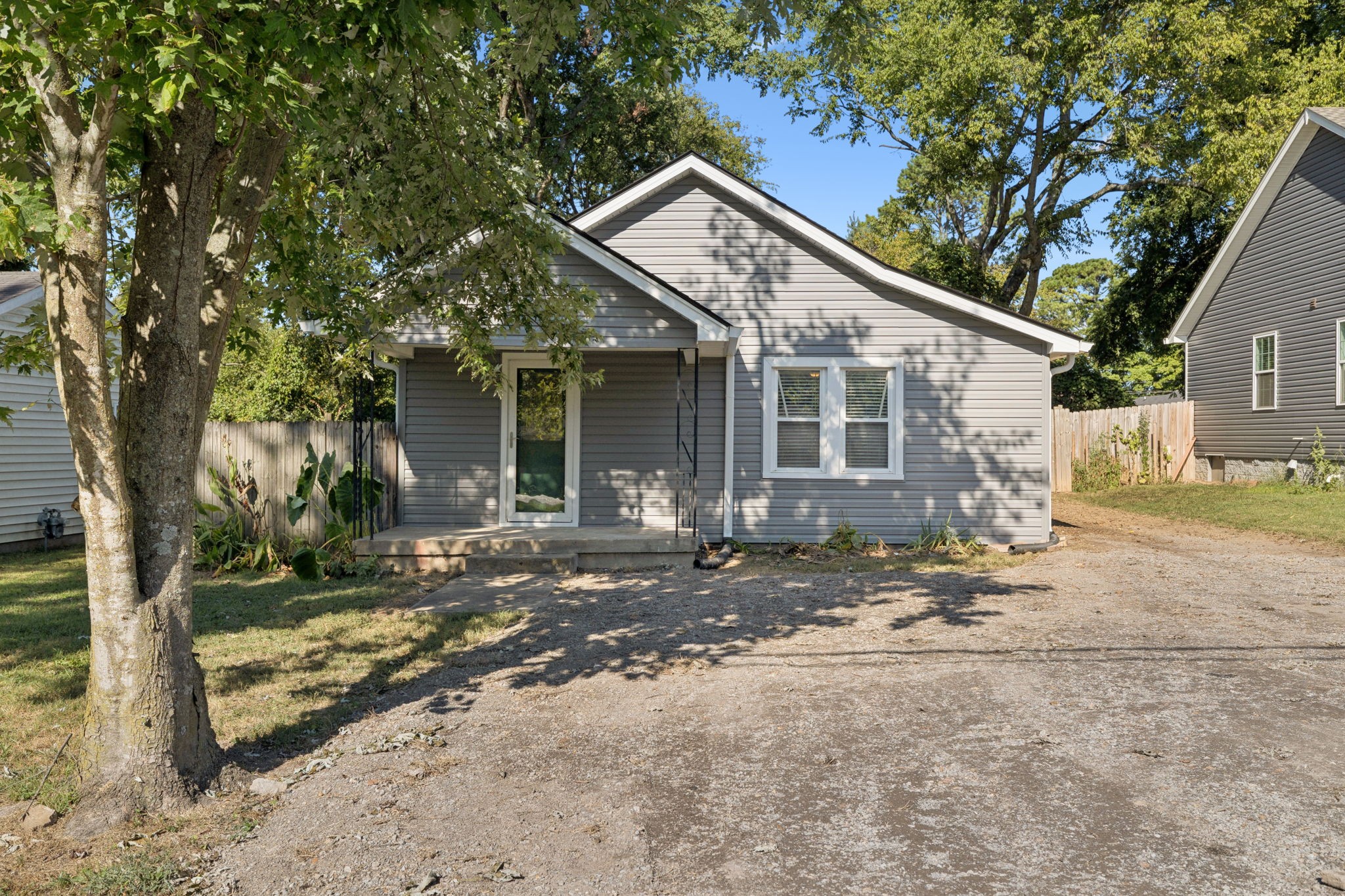 1008 Bales Street Gallatin, TN 37066 - Photo 18 of 19 a view of a house with a yard and large tree