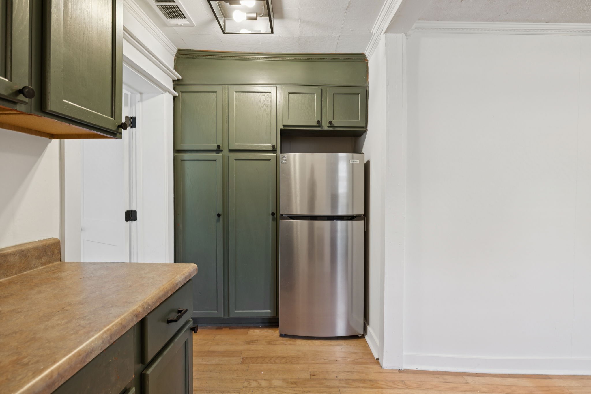 1008 Bales Street Gallatin, TN 37066 - Photo 6 of 19 a kitchen with a refrigerator and countertop