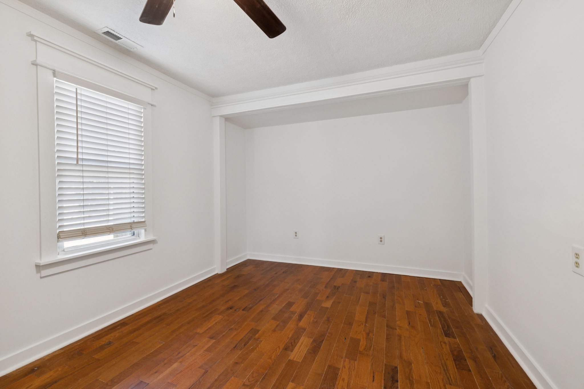 1008 Bales Street Gallatin, TN 37066 - Photo 7 of 19 a view of empty room with wooden floor and fan