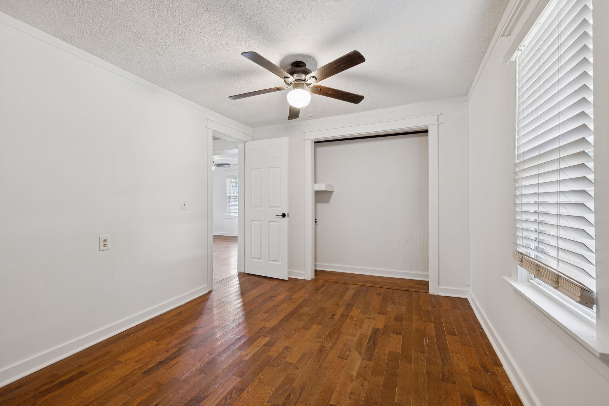1008 Bales Street Gallatin, TN 37066 - Photo 8 of 19 a view of an empty room with wooden floor and a window