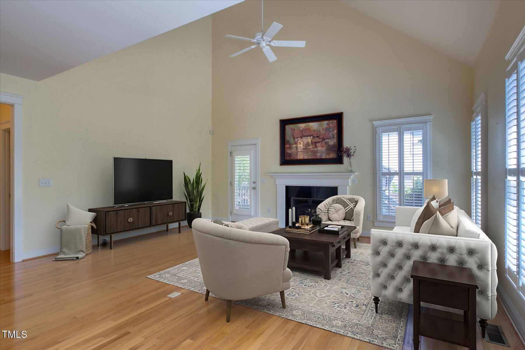 121 Bridgegate Drive Cary, NC 27519 - Photo 11 of 38 a living room with furniture a fireplace and a flat screen tv