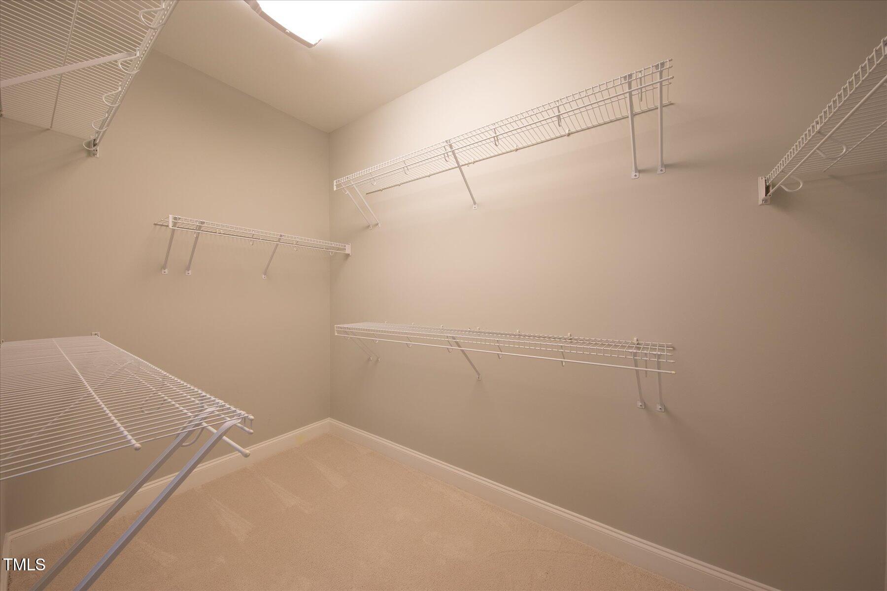 121 Bridgegate Drive Cary, NC 27519 - Photo 19 of 38 a view of a room with racks on the wall