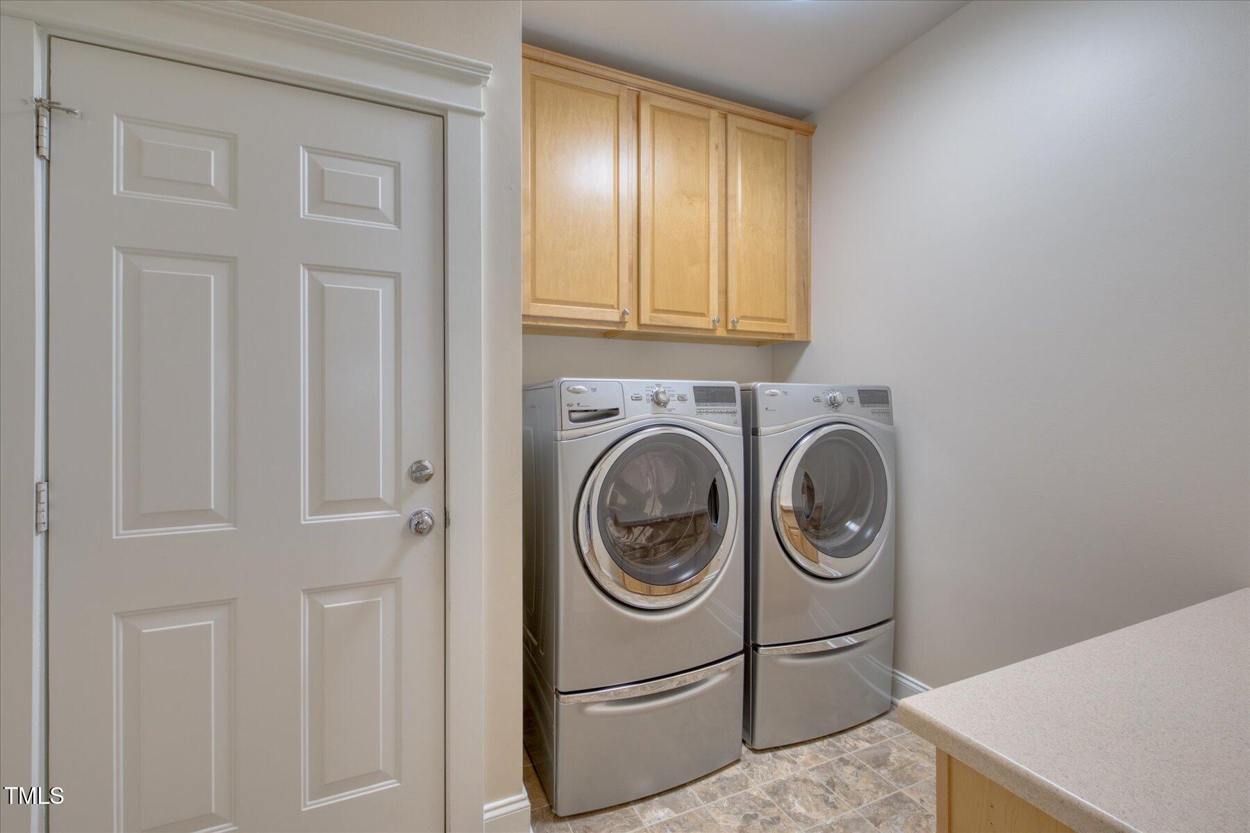 121 Bridgegate Drive Cary, NC 27519 - Photo 20 of 38 a utility room with dryer and washer