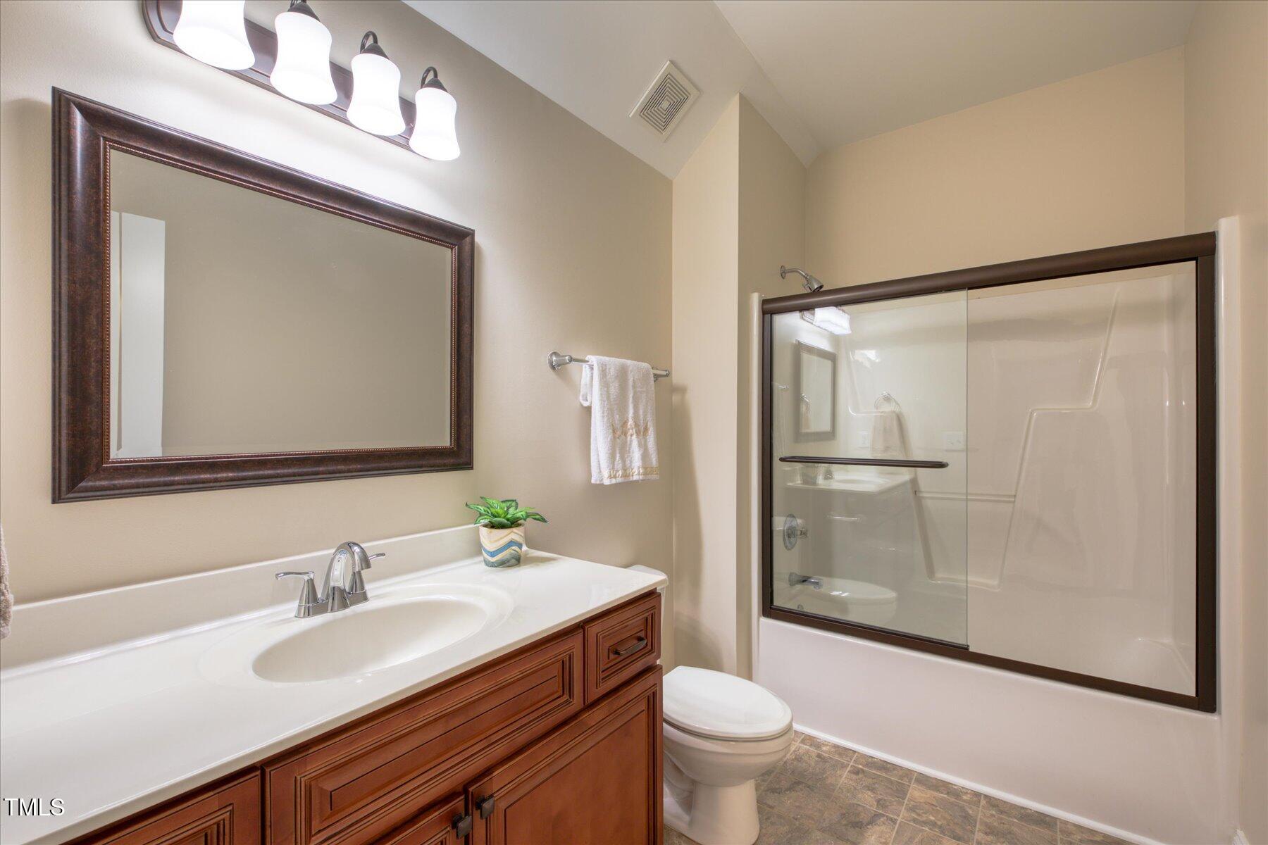 121 Bridgegate Drive Cary, NC 27519 - Photo 23 of 38 a bathroom with a sink toilet and shower
