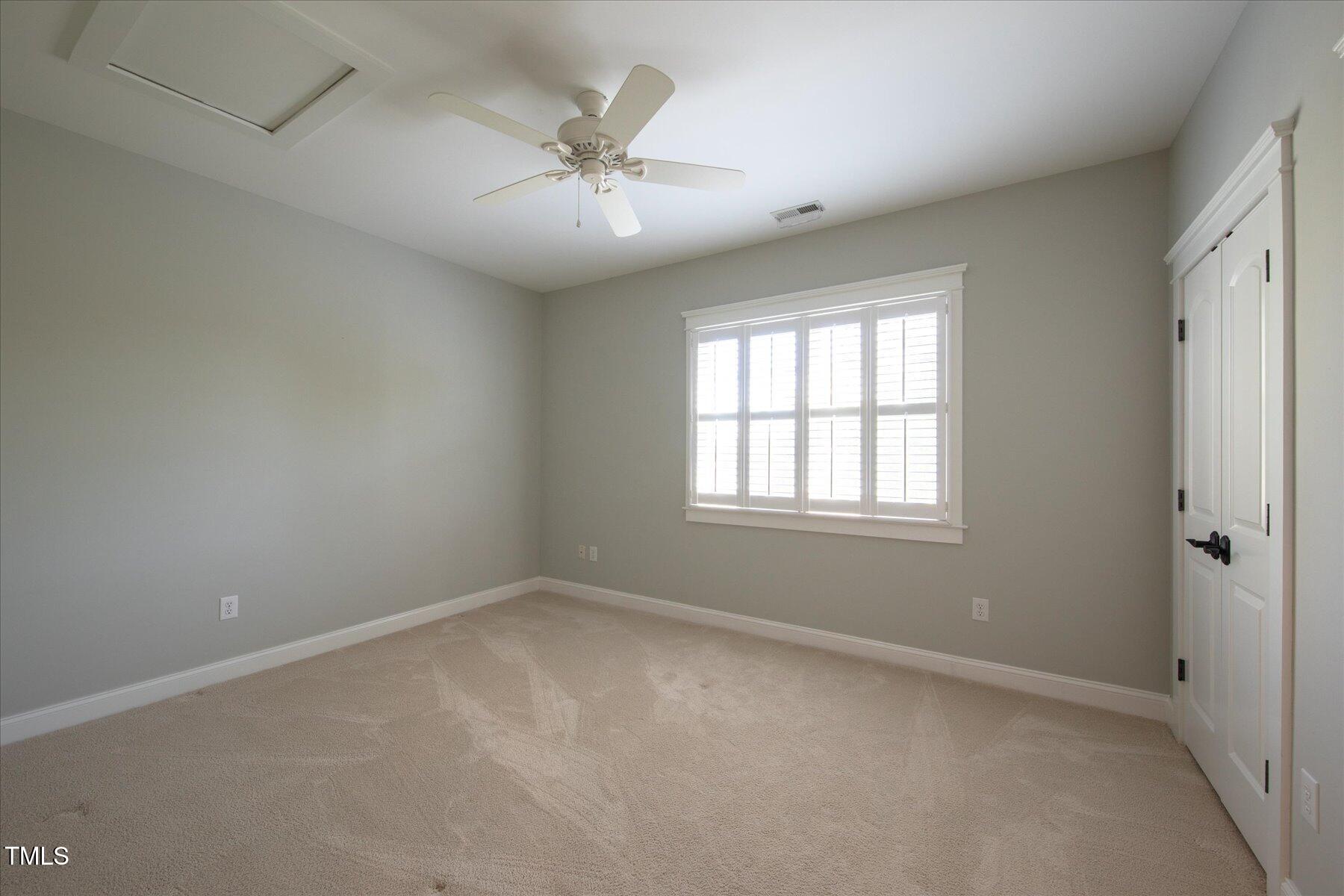 121 Bridgegate Drive Cary, NC 27519 - Photo 24 of 38 a view of an empty room with a window