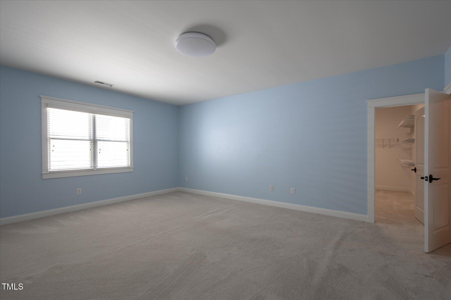 121 Bridgegate Drive Cary, NC 27519 - Photo 26 of 38 an empty room with windows and closet
