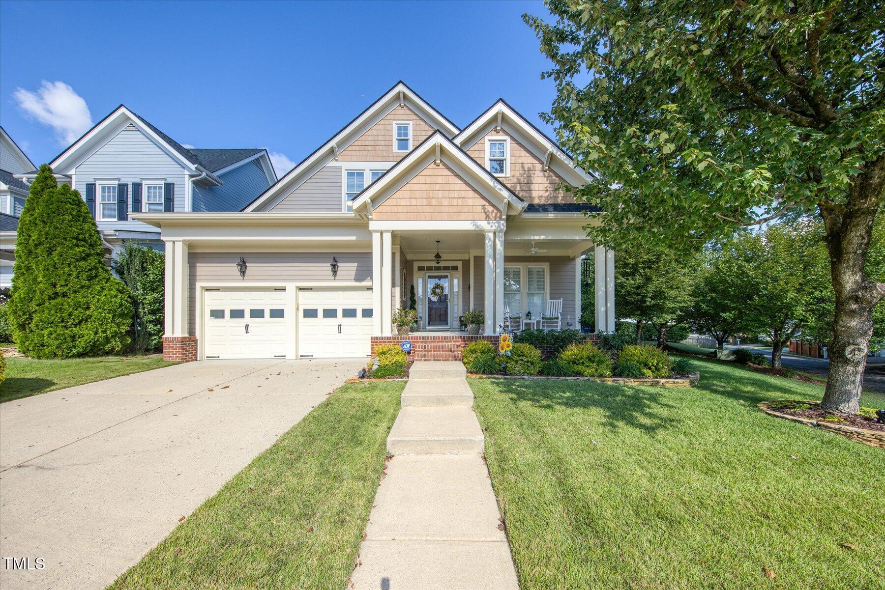 121 Bridgegate Drive Cary, NC 27519 - Photo 2 of 38 a front view of a house with yard