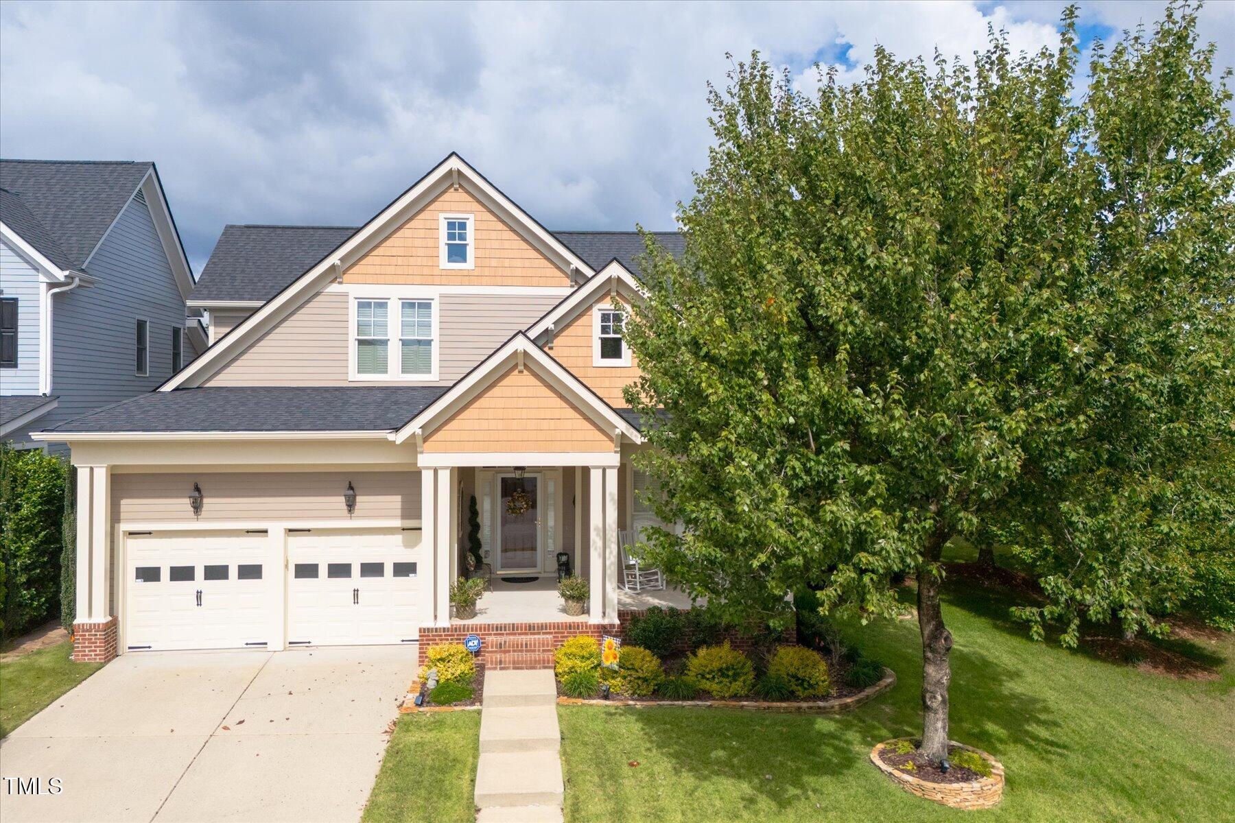 121 Bridgegate Drive Cary, NC 27519 - Photo 3 of 38 a front view of a house with garden