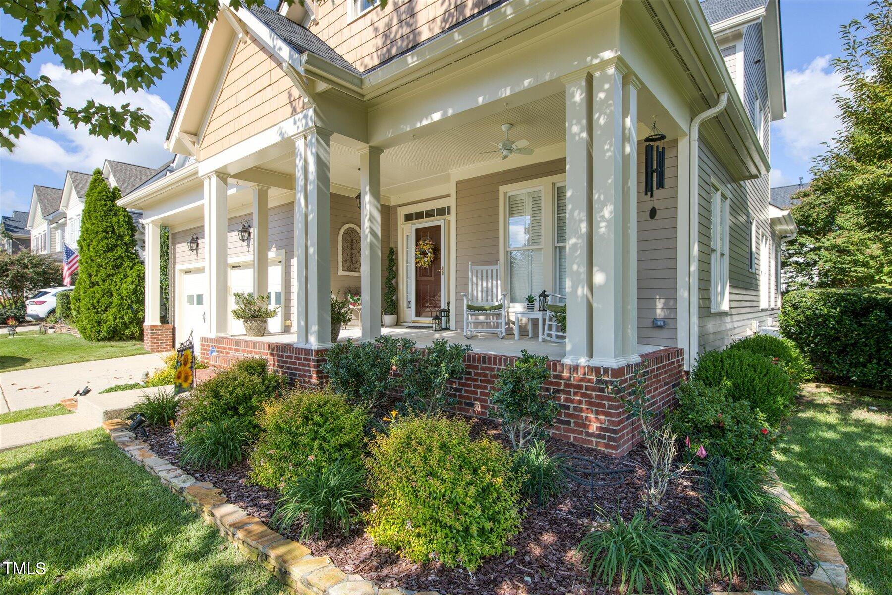121 Bridgegate Drive Cary, NC 27519 - Photo 4 of 38 a view of a building with a yard