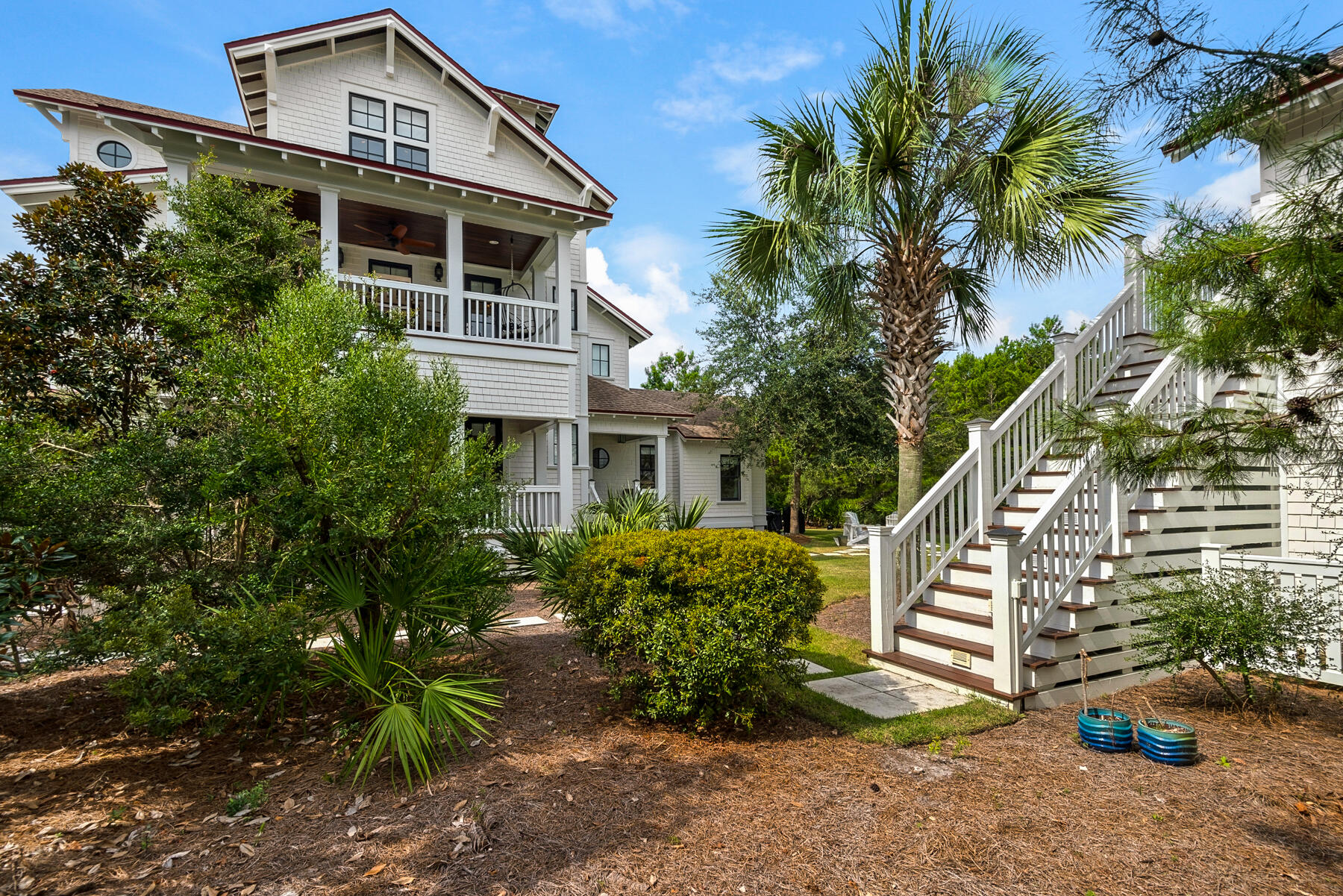 44 Bridge Water Ln Inlet Beach Inlet Beach, FL 32461 - Photo 14 of 83 a front view of a house with entryway and plants