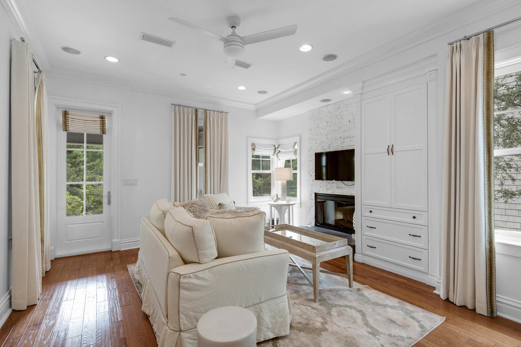 44 Bridge Water Ln Inlet Beach Inlet Beach, FL 32461 - Photo 21 of 83 a living room with furniture a flat screen tv and a fireplace