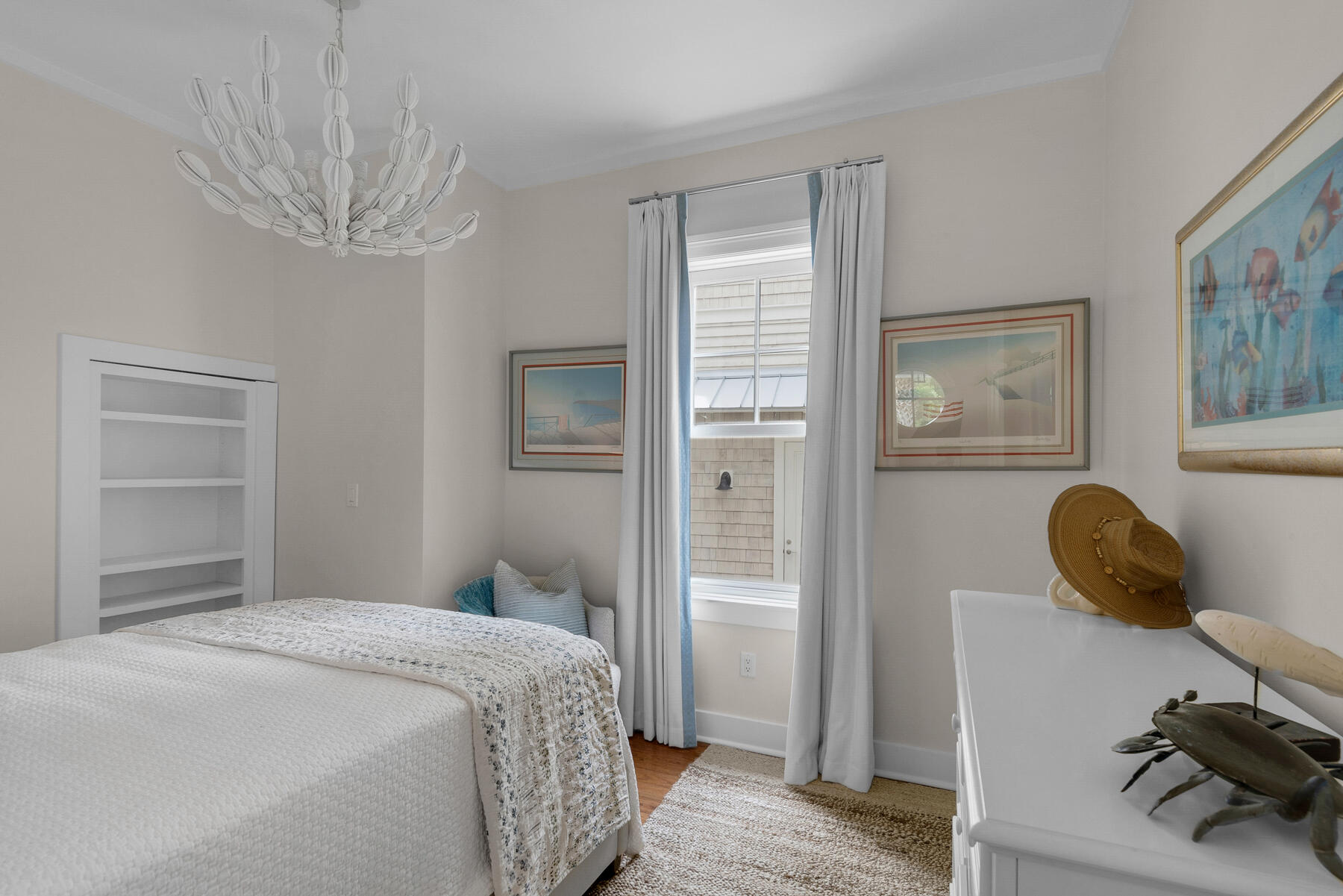 44 Bridge Water Ln Inlet Beach Inlet Beach, FL 32461 - Photo 36 of 83 a bedroom with a bed and a chandelier