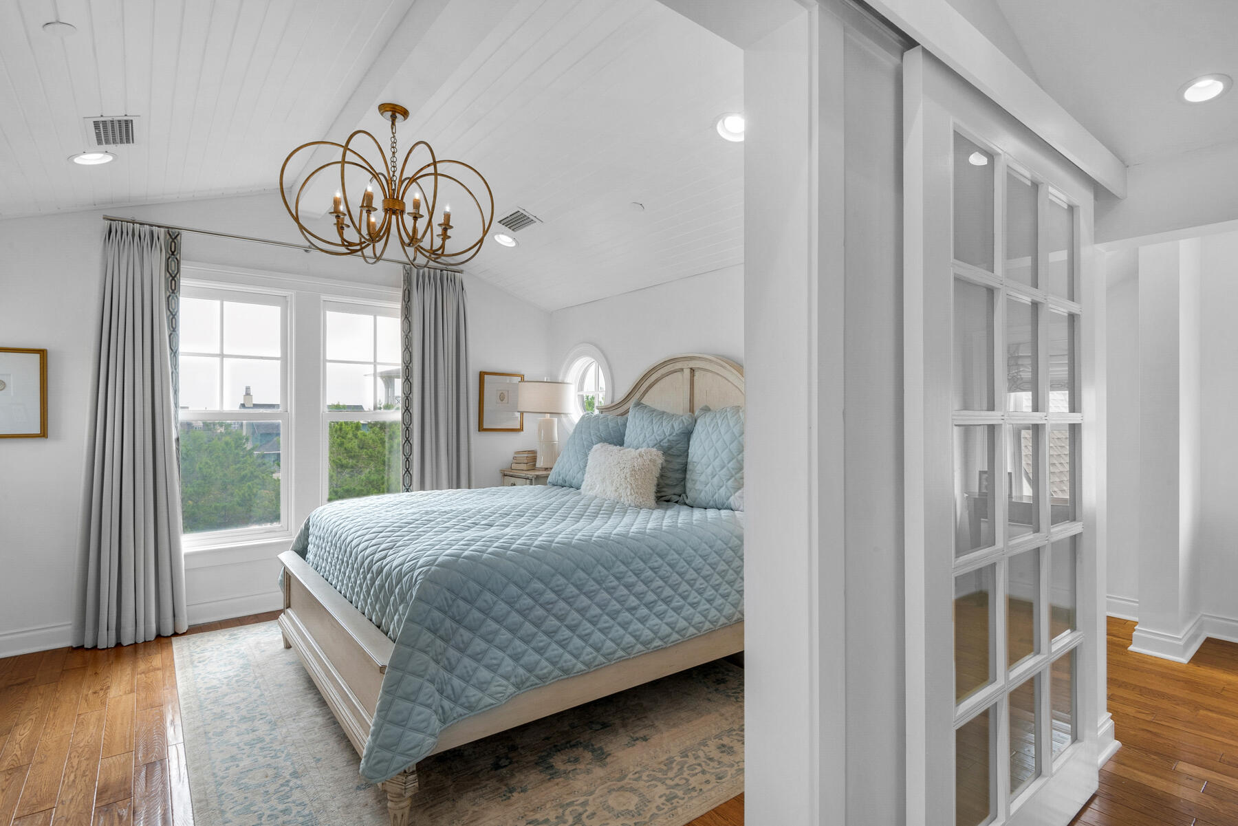 44 Bridge Water Ln Inlet Beach Inlet Beach, FL 32461 - Photo 59 of 83 a bedroom with a bed and a chandelier