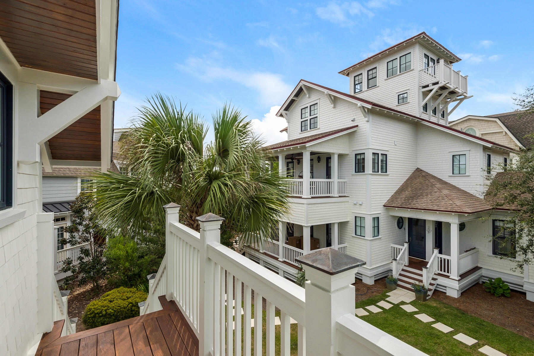 44 Bridge Water Ln Inlet Beach Inlet Beach, FL 32461 - Photo 76 of 83 a view of a white house with large windows and a small yard