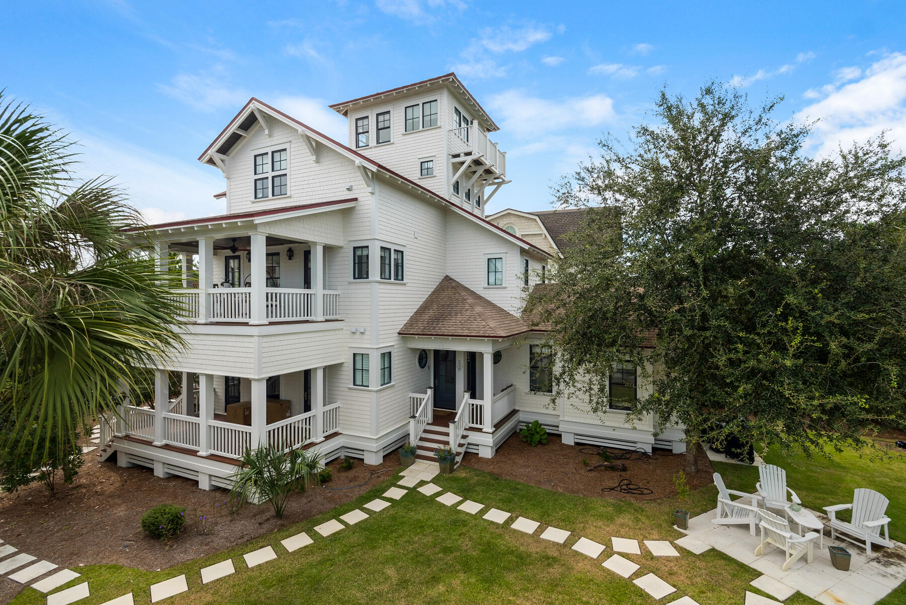 44 Bridge Water Ln Inlet Beach Inlet Beach, FL 32461 - Photo 77 of 83 a front view of a house with a yard table and chairs