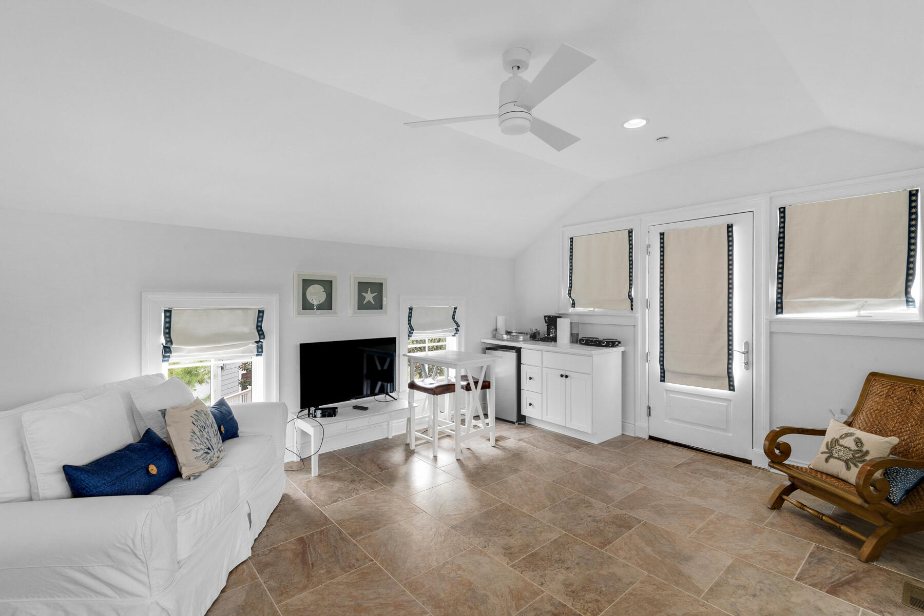 44 Bridge Water Ln Inlet Beach Inlet Beach, FL 32461 - Photo 80 of 83 a living room with furniture a flat screen tv and a fireplace