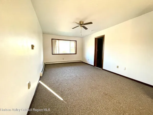 a view of empty room with windows