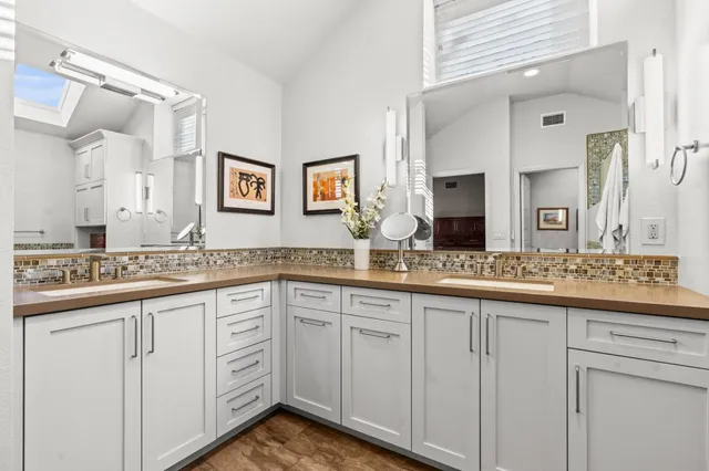 a bathroom with a shower and a sink