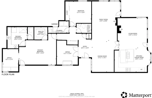 a view of a house with large windows and a table and chairs