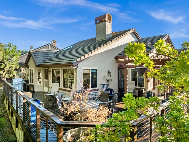 a view of a chairs and table in the balcony