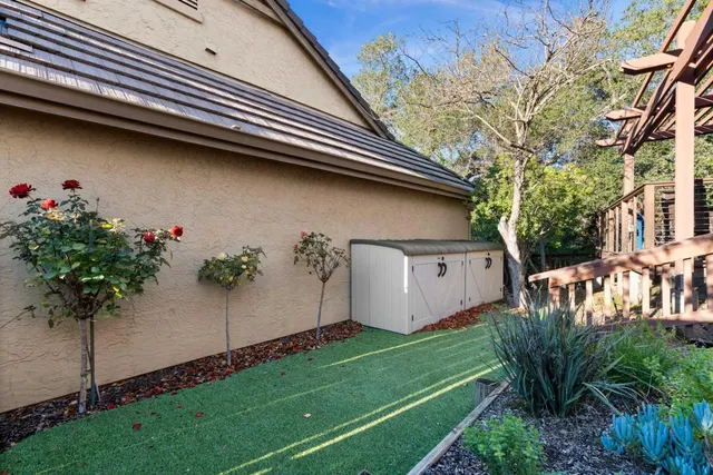 a view of a patio with table and chairs and wooden floor