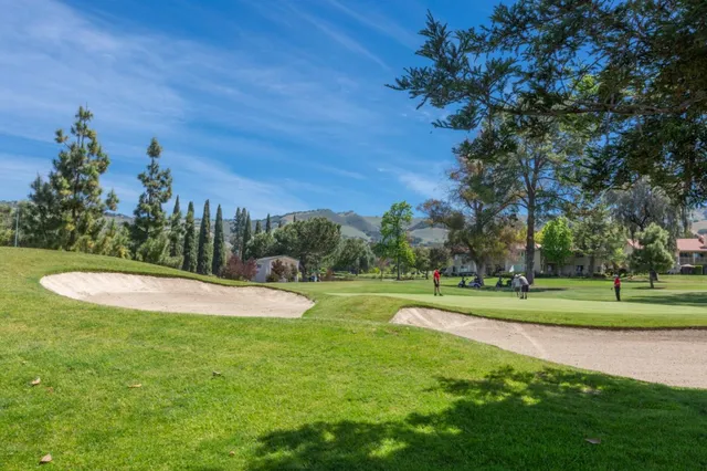 a view of a golf course with a lake