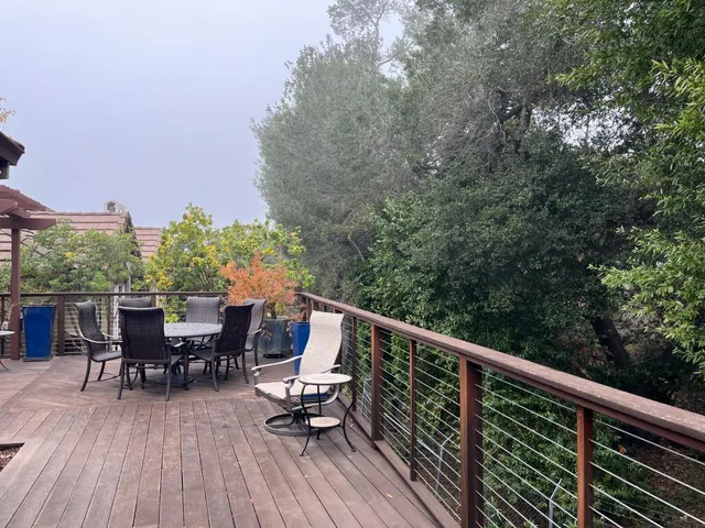 a view of balcony with furniture and wooden floor
