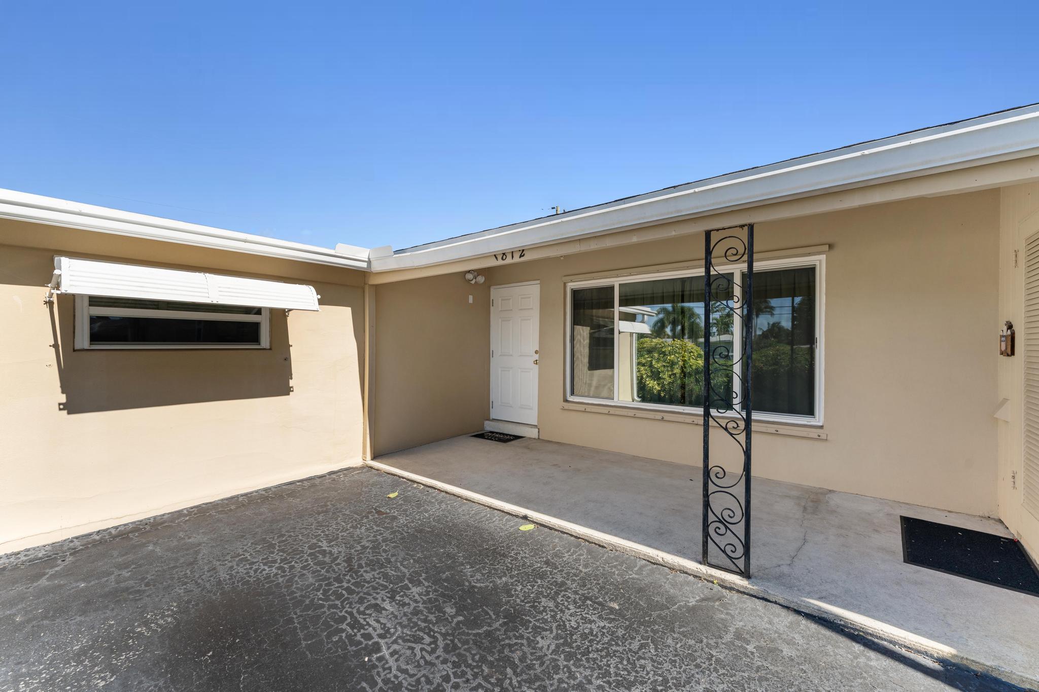 1812 High Ridge Road Lake Worth, FL 33461 - Photo 2 of 43 Front