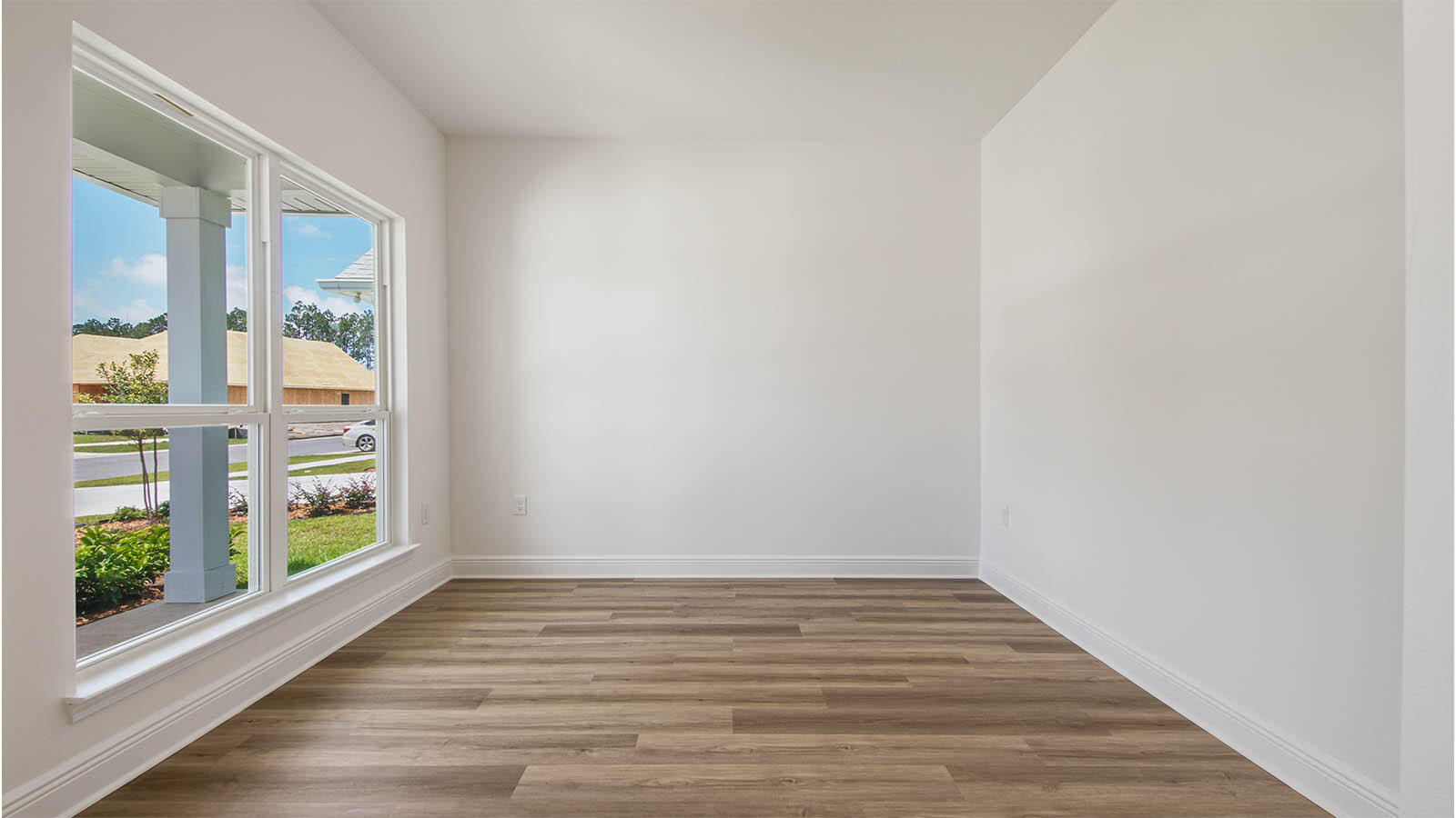 30 Foxtrail Run Freeport, FL 32439 - Photo 5 of 30 a view of an empty room with wooden floor and a window